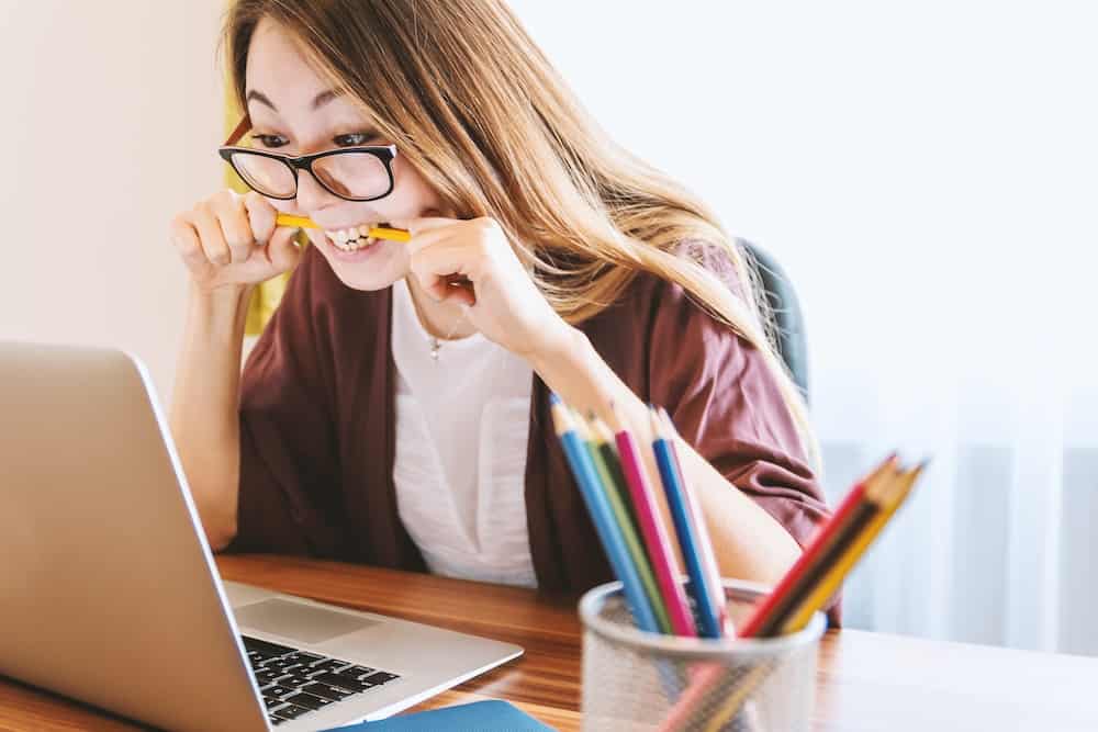 student loan felony record hub student eating pencil image