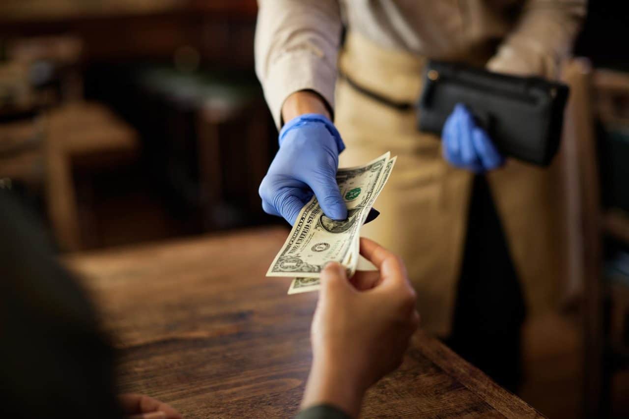 closeup customer paying waitress cafe 637285 8134 jobs for felons and felony record hub website